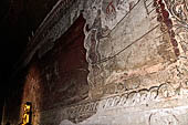 Bagan Myanmar. Sulamani temple. Large painted reclining Buddha. 